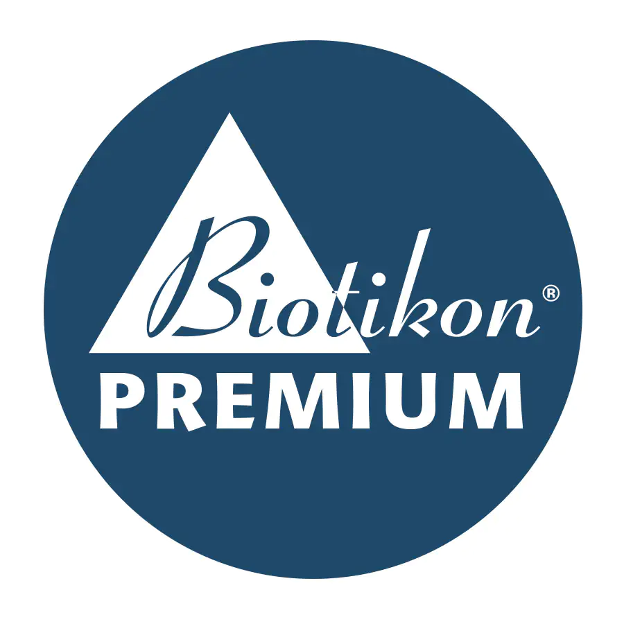 Logo von Biotikon PREMIUM auf blauem Hintergrund, kreisförmig.